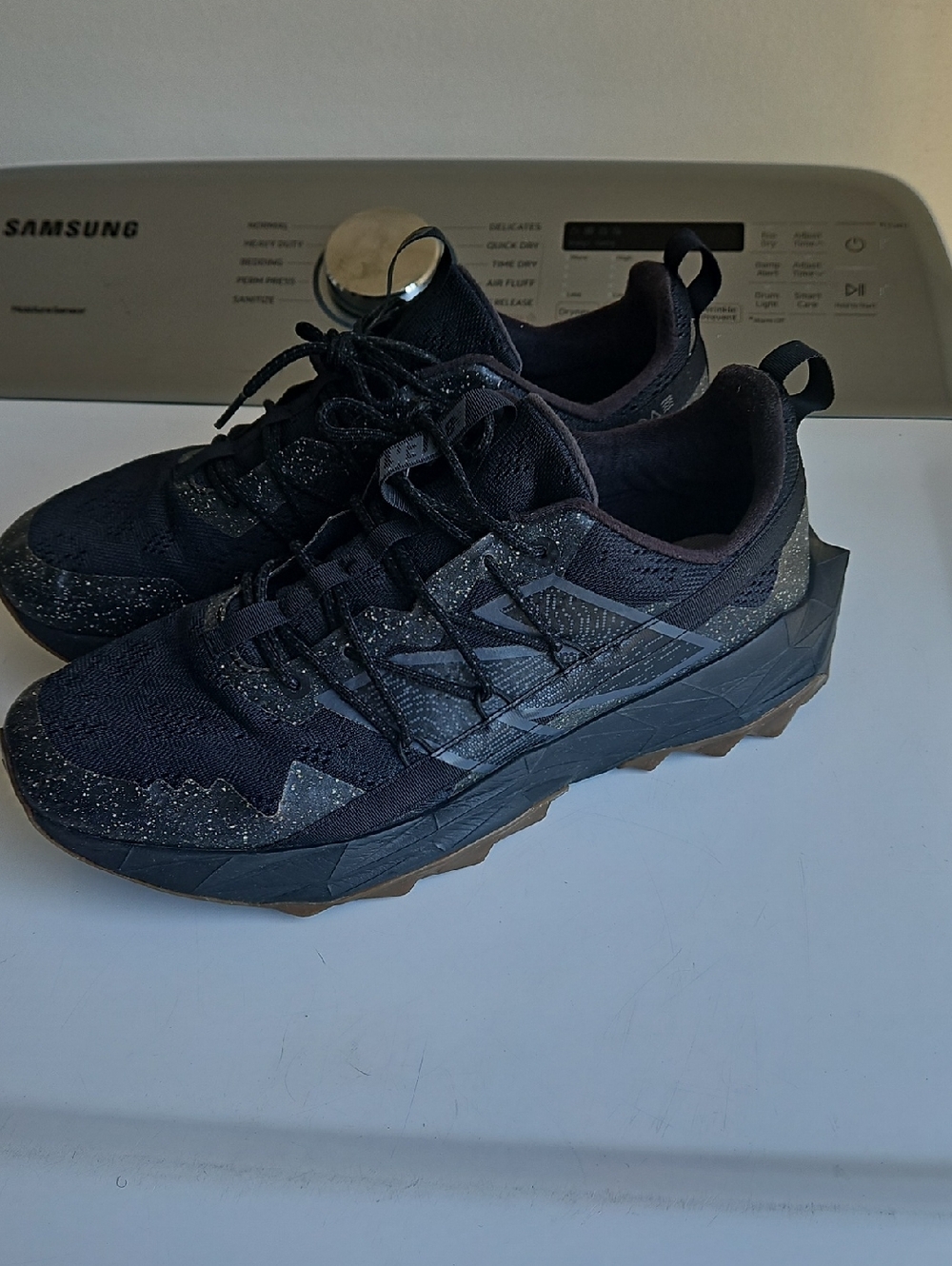 New Balance Men's Black Athletic Trail Sneakers with Brown Outsole